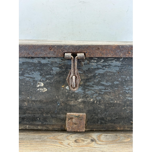 529 - A 19th century ebonised pine and metal banded rectangular storage box