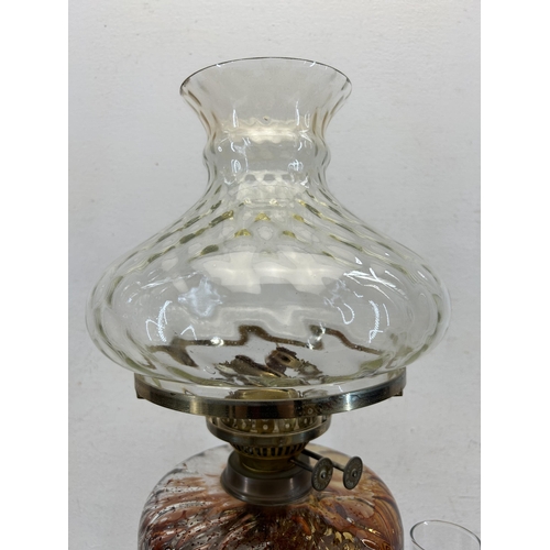 531 - An early 20th century Duplex brass oil lamp with glass reservoir and shade - approx. 56cm high