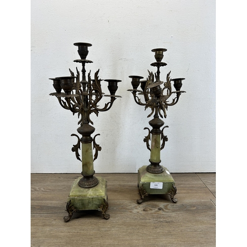 535 - A pair of 19th century style gilt metal and onyx four branch candelabras - approx. 46cm high