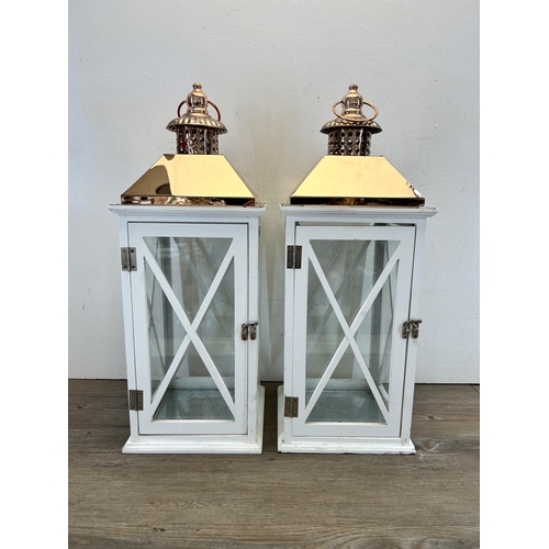 536 - A pair of white painted and copper effect hanging lanterns - approx. 58cm high