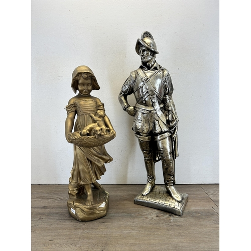 538 - Two chalkware figurines, one gilt girl holding puppies and one silver painted knight - largest appro... 