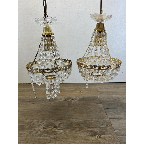 542 - A pair of gilt metal and glass droplet chandeliers