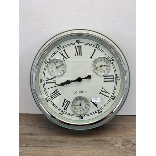 552 - A contemporary O Star circular four time zone wall clock - approx. 50cm diameter