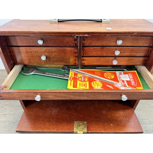 557 - A mid 20th century Union wooden engineer's cabinet with contents, fall front drawer and eight intern... 