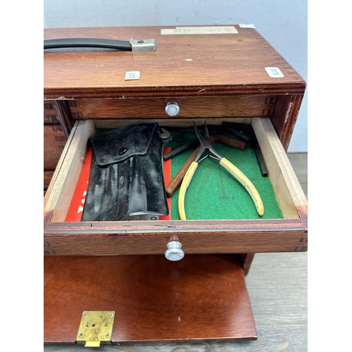 557 - A mid 20th century Union wooden engineer's cabinet with contents, fall front drawer and eight intern... 