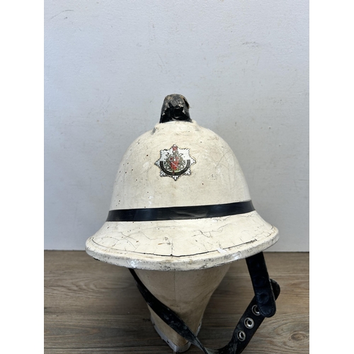 565 - A 1980s Greater Manchester County Fire Service safety helmet - approx. 23cm high x 36cm long x 27cm ... 