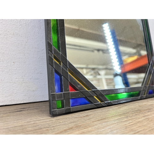 571 - An Art Deco style leaded stained glass mirror - approx. 38cm high x 28cm wide