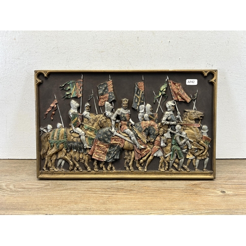 574 - A Marcus Designs Agincourt 1415 battle scene 3-D ceramic wall plaque featuring King Henry V - approx... 