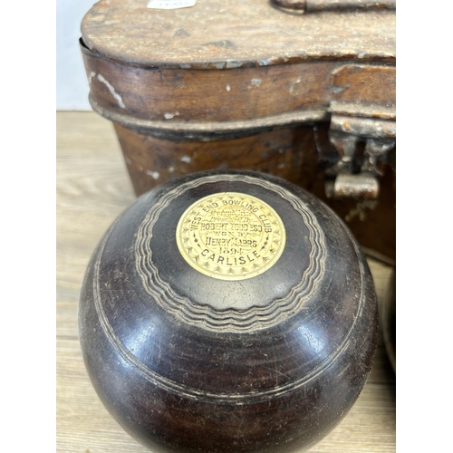 577 - A cased pair of late 19th century Thomas Taylor No. 3 Bias lignum vitae and bone crown green bowls