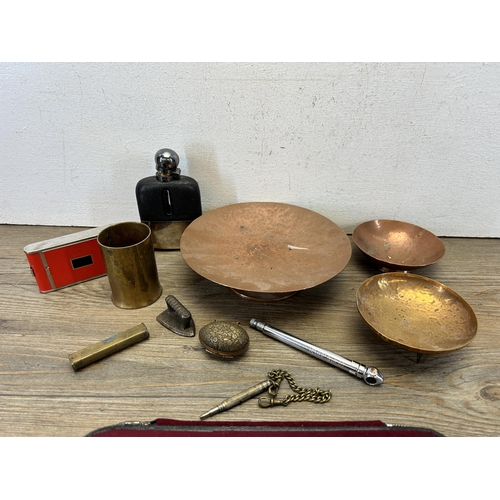 579 - A collection of items to include hammered copper bowls, early 20th century brass spirit level, late ... 