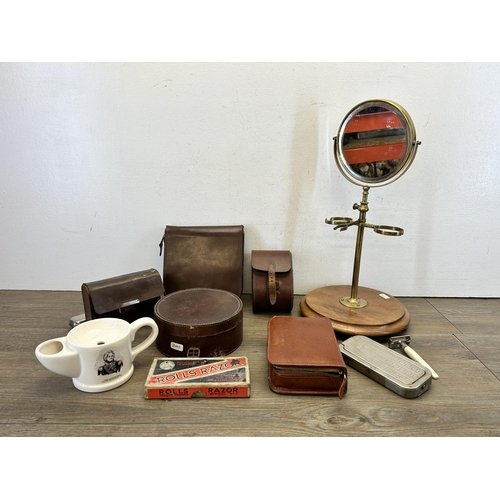 580 - A collection of early/mid 20th century vanity items to include brass shaving mirror on wooden circul... 