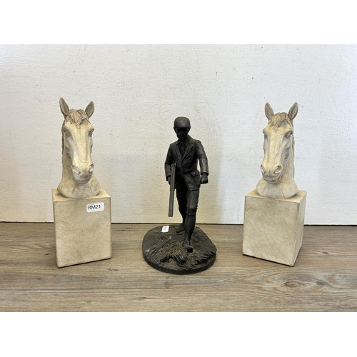 583 - Two items, one bronze effect resin hunter figurine and one pair of white painted horse bookends - la... 