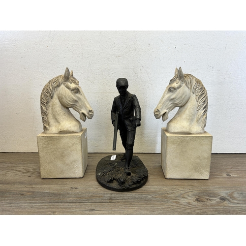 583 - Two items, one bronze effect resin hunter figurine and one pair of white painted horse bookends - la... 