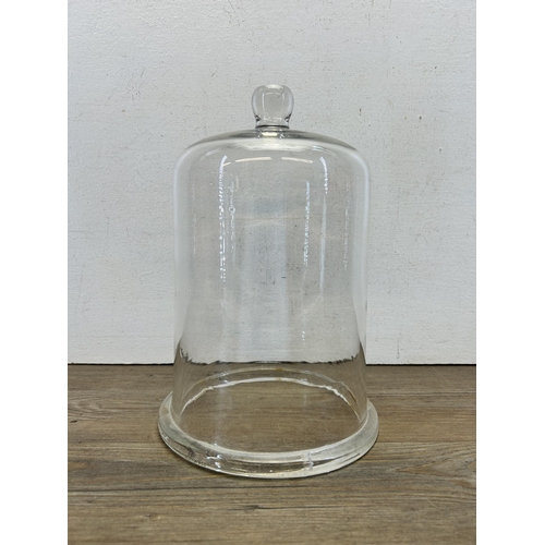 585 - A Victorian glass cloche - approx. 30cm high x 20cm diameter