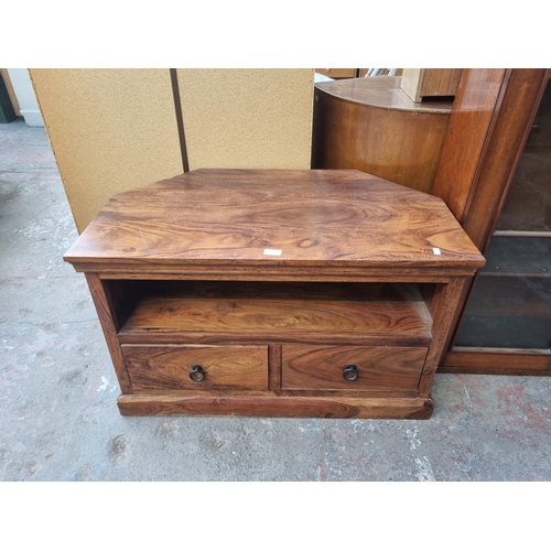 111 - An Indian sheesham wood two drawer TV stand