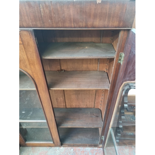 113 - A Victorian walnut wall mountable two door bookcase - approx. 141cm high x 92cm wide x 27cm deep