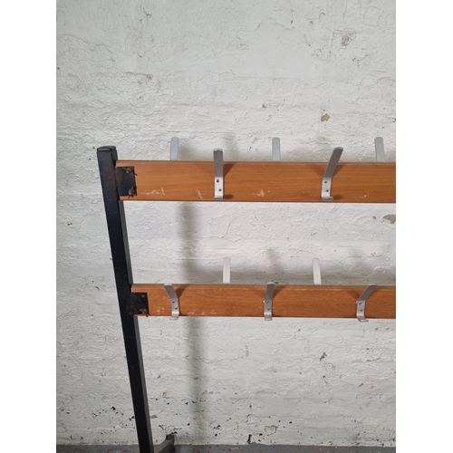 84 - A mid 20th century beech and black metal free standing school coat rack - approx. 125cm high x 154cm... 