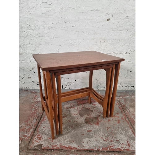 85 - A teak nest of three tables