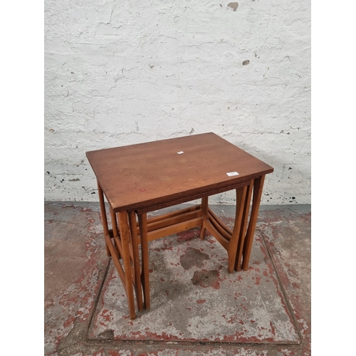 85 - A teak nest of three tables