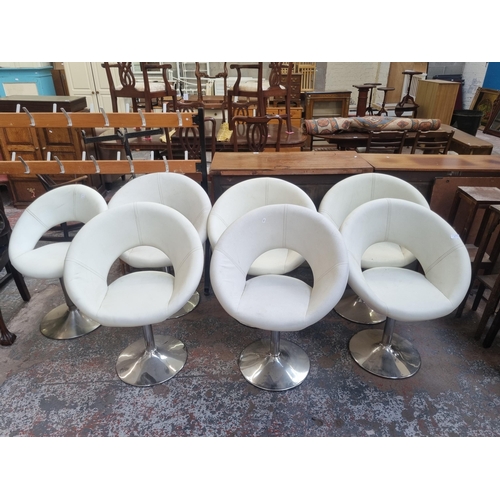 92 - A set of six modern white leatherette and chrome plated kitchen bar stools together with one further... 