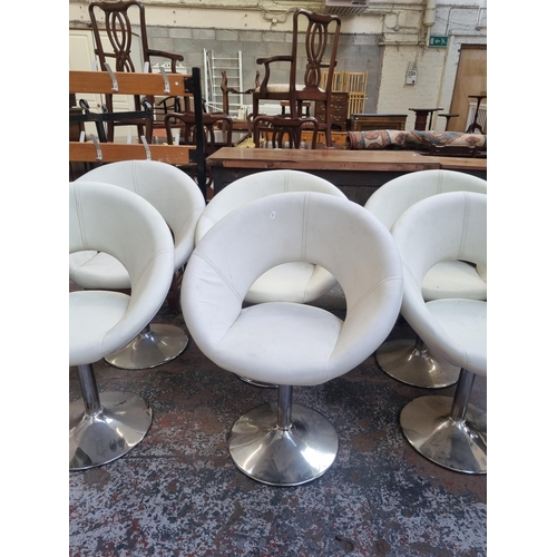 92 - A set of six modern white leatherette and chrome plated kitchen bar stools together with one further... 