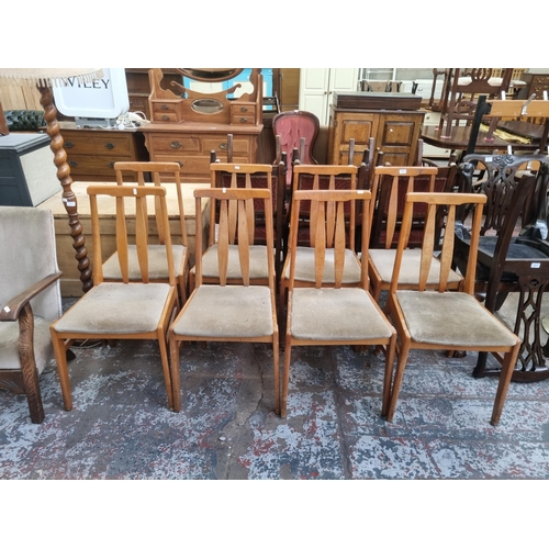 94 - Eight mid 20th century beech and brown fabric dining chairs