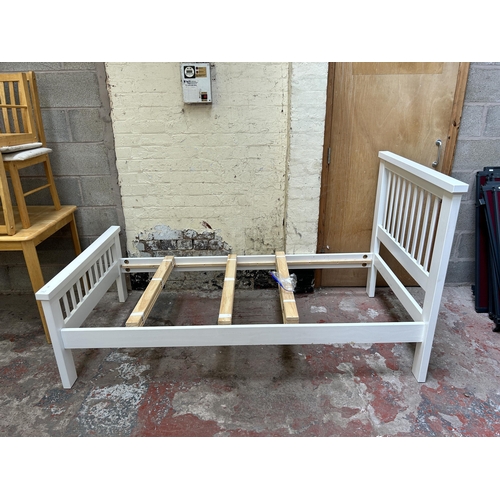 23 - A modern white painted single bed frame