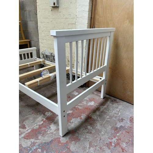 23 - A modern white painted single bed frame