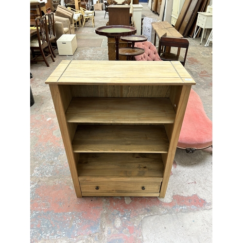 24 - A Mexican pine three tier bookcase