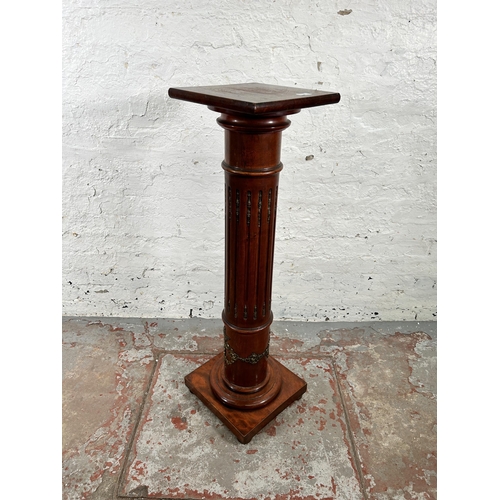 26 - A French Empire style mahogany and gilt metal jardinière stand - approx. 107cm high