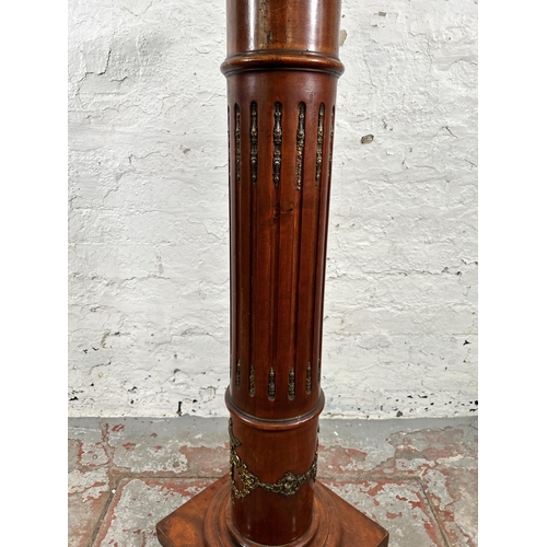 26 - A French Empire style mahogany and gilt metal jardinière stand - approx. 107cm high