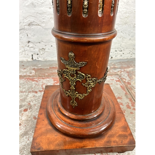 26 - A French Empire style mahogany and gilt metal jardinière stand - approx. 107cm high