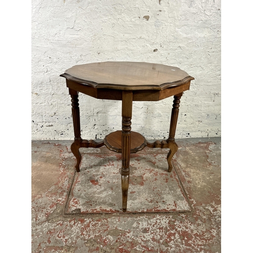 31 - A late 19th/early 20th century walnut serpentine two tier occasional table