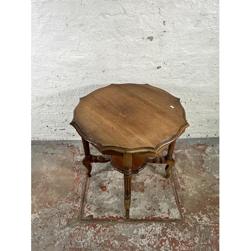 31 - A late 19th/early 20th century walnut serpentine two tier occasional table