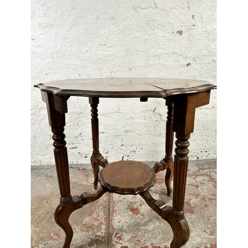 31 - A late 19th/early 20th century walnut serpentine two tier occasional table