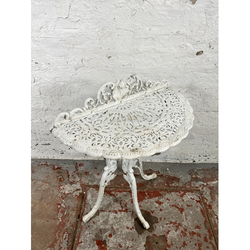 38 - A Victorian style white painted cast metal half moon console table