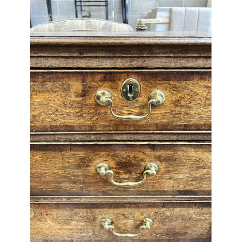 41 - A George III oak and mahogany crossbanded chest of two short over three long drawers with bracket su... 