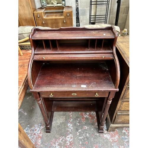 43 - A mahogany roll top bureau