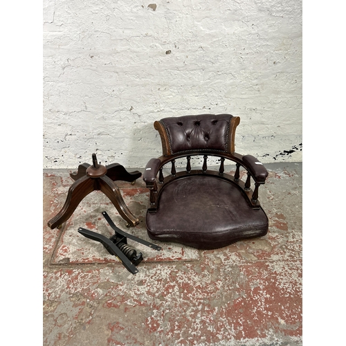 45 - A mahogany and purple leatherette Chesterfield captain's swivel desk chair