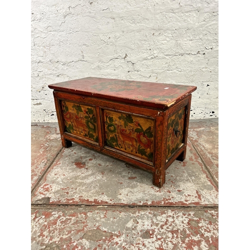 49 - A Tibetan style hand painted wooden dowry chest - approx. 35cm high x 65cm wide x 29cm deep