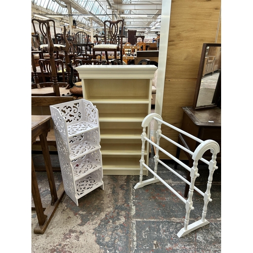 5 - Three pieces of white painted furniture, five tier bookcase, towel rail and four tier bookshelf