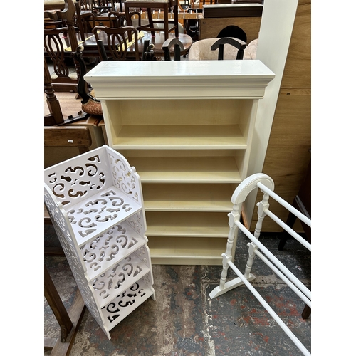 5 - Three pieces of white painted furniture, five tier bookcase, towel rail and four tier bookshelf