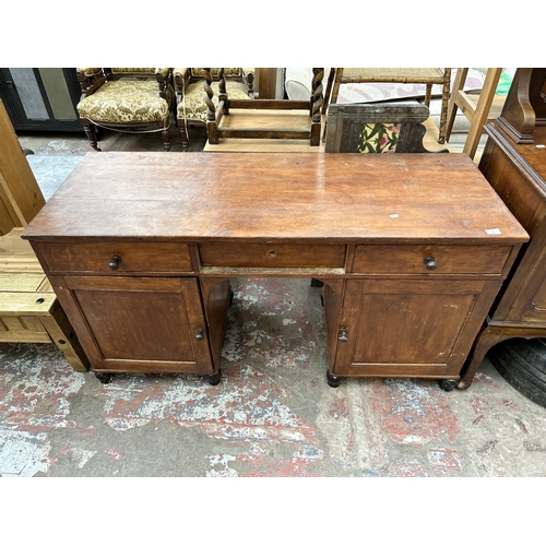 53 - A late 19th/early 20th century stained pine pedestal desk - approx. 78cm high x 146cm wide x 55cm de... 