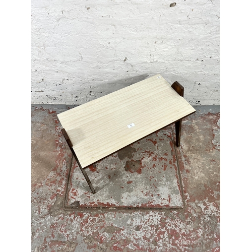 63 - A mid 20th century oak and formica rectangular coffee table