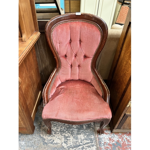 66 - A Victorian style stained beech and pink fabric upholstered balloon back nursing chair