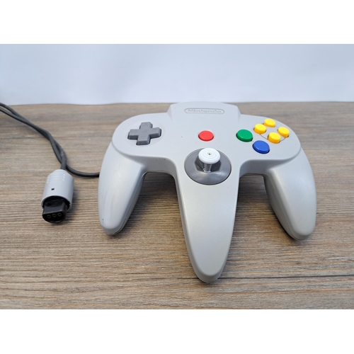 675 - A Nintendo 64 console with five games, controller and memory expansion