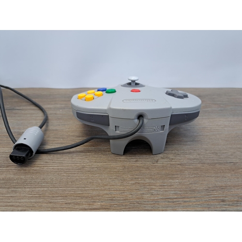 675 - A Nintendo 64 console with five games, controller and memory expansion