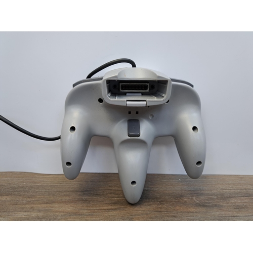 675 - A Nintendo 64 console with five games, controller and memory expansion