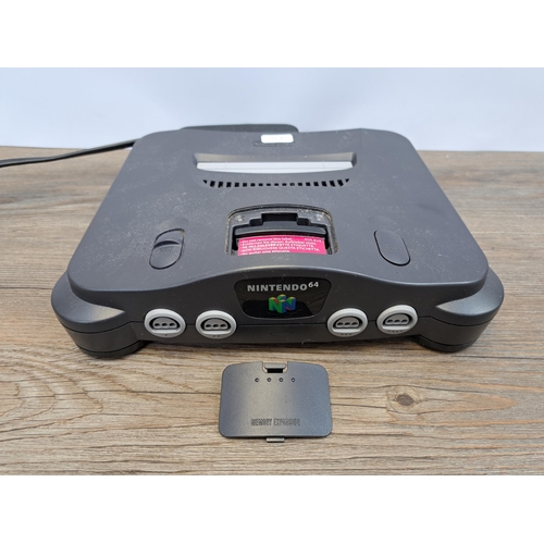 675 - A Nintendo 64 console with five games, controller and memory expansion