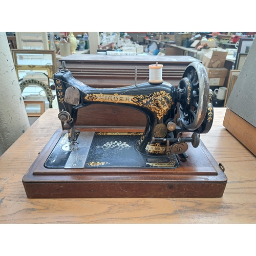 688 - A vintage Singer sewing machine